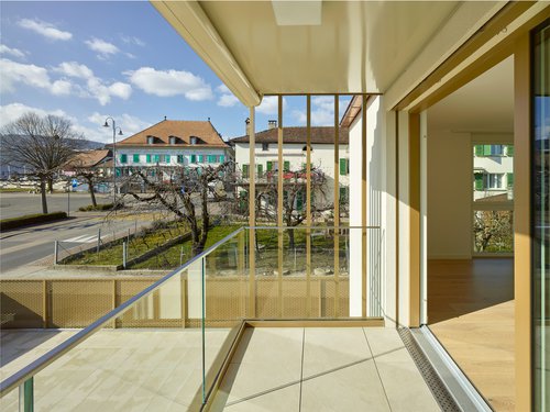 Architecture de CCHE pour un bâtiment de logements et de surfaces commerciales Suisse