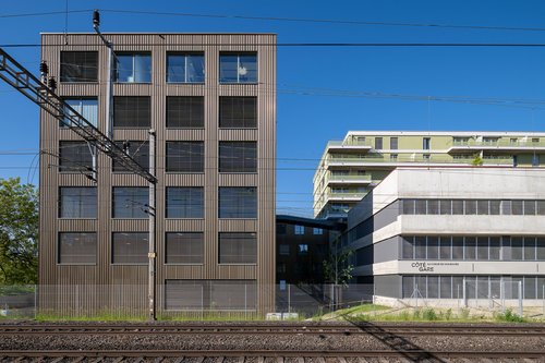 Architecture et Réalisation de CCHE pour le Quartier résidentiel à Bussigny Côté Gare Suisse