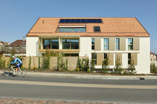 Architecture de CCHE pour un bâtiment de logements et de surfaces commerciales Suisse